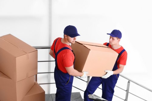 Moving boxes and furniture prepared for home moves in Stjohnswood