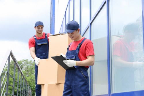 Man and van team sorting reusable household items for recycling and donation