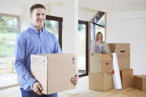 Careful wrapping of fragile household items during packing in Stjohnswood