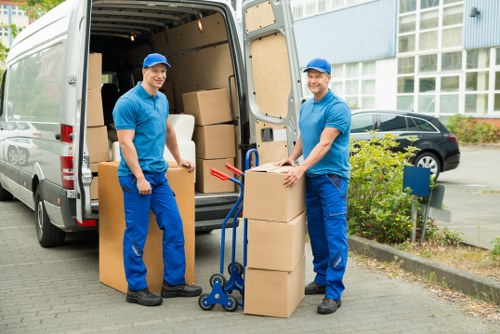 Moving team organizing boxes and furniture for a Stjohnswood house move