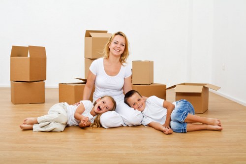 Professional movers packing and loading household items in Stjohnswood