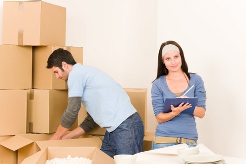Customer booking details and moving checklist on a desk