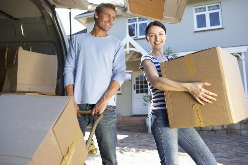 Loading furniture into a removal truck for a home relocation